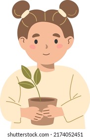 A girl with a small plant in a pot.