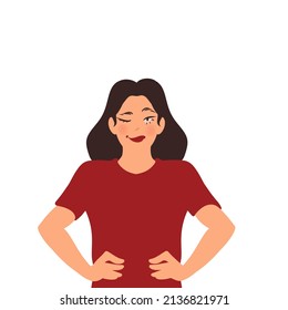 the girl smiles and winks, her hands lie on her belt