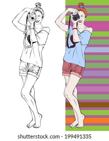 girl standing barefoot in shorts with red hair holding a photo camera and looks into her narrowed eyes on a striped background
