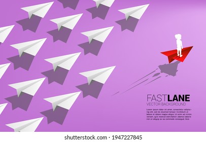girl standing on red origami paper airplane is move faster than group of white. Concept of fast lane for education and children development.
