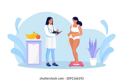 Girl standing on scales. Pretty young woman on diet trying to control body weight. Dietolog doctor make a diet plan for overweight and obese people for weight loss. Healthy Lifestyle, Dieting Concept