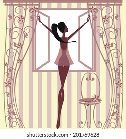 Girl standing at the window 