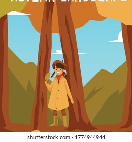 The girl stands between the tree trunks and holds an autumn leaf. Mountains and blue bright sky in the background.