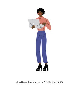 Girl stands and looks at something on a laptop cartoon vector illustration