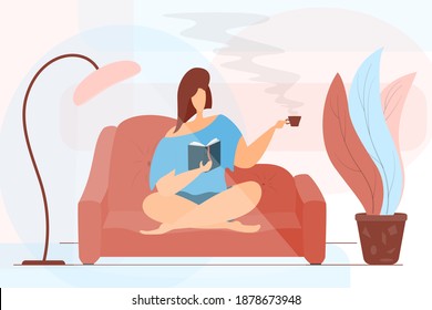 The girl stayed at home, reads a book and drinks hot coffee. The woman is sitting on the sofa with her legs crossed. Home education. Hobby concept, what to do during quarantine.