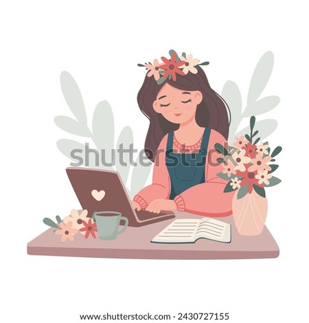 Girl student studing or working on lapltop sitting at table