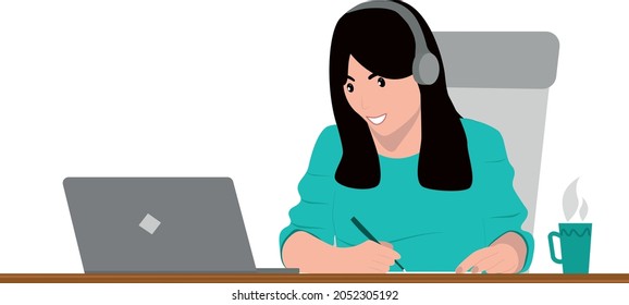 The girl is studying a foreign language online. The girl is studying online. Girl in headphones is engaged in a laptop and drinks tea