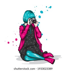 Girl in stylish clothes and with a camera. Fashion and style, vintage and retro.