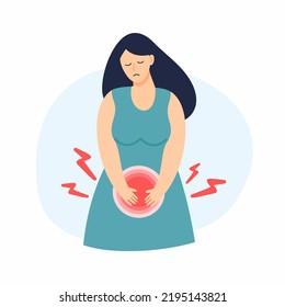 A girl suffering from pain is holding on to her lower abdomen. Cystitis, pain during menstruation.	
