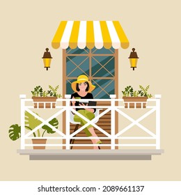 A girl in a summer hat sits on the balcony and drinks tea against the background of a part of the wall of a house with a window shed and a balcony fence. Building facade elements vector illustration.
