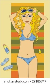 The girl sunbathing on a beach
