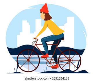 Girl in a sweater riding a bicycle in the park. Vector winter illustration in flat style.