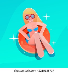 A girl swims on a circle in the ocean. Summer vacation.