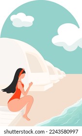 girl in swimsuit sits in profile on the beach by the sea against the background of the geodome