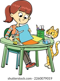 girl at the table is shredding papers cat is looking at her