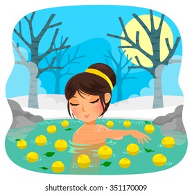 girl taking a bath with yuzu fruit (tradition during the Japanese holiday of winter solstice)