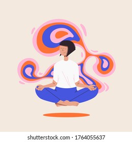 A girl taking care of herself by meditating in her room, feeling peace and calmness