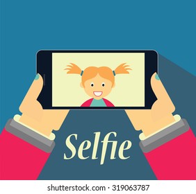 Girl taking selfie picture on her phone