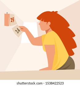 the girl tears off the sheet of the calendar. the eve of the holiday. calendar date