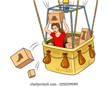 Girl throws out boxes with clothes and shoes from air balloon basket pop art retro vector illustration. Isolated image on white background. Comic book style imitation.