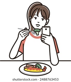 A girl touching her smartphone while eating