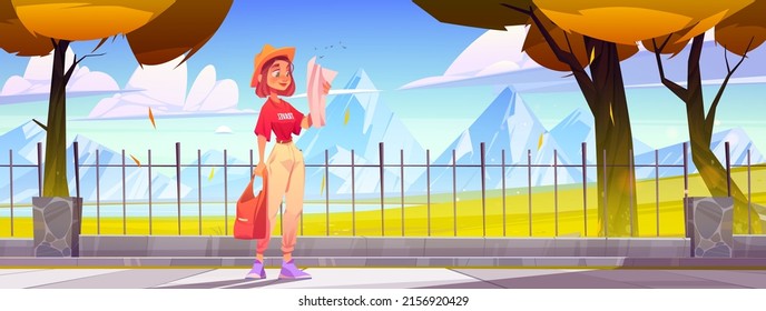 Girl tourist looks at map on pavement with fence and orange trees. Vector cartoon illustration of young woman traveler on background of autumn landscape with mountains, grass and lake