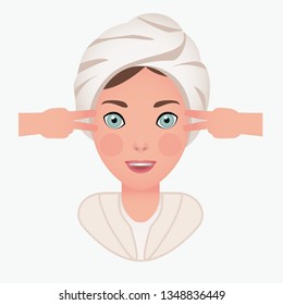girl with a towel on her head does a facial massage