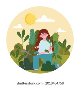 girl trimming bushes with scissors garden