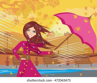 girl with umbrella on a rainy autumn day