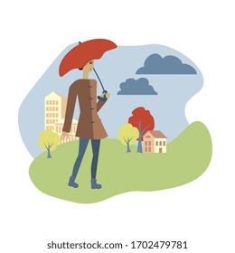Girl with an umbrella walks in park