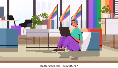 girl using laptop lgbt rainbow flag transgender love generation Z concept office interior horizontal
