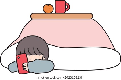 Una chica que usa un smartphone mientras descansa en el kotatsu