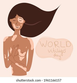 A girl with vitiligo hugs her body. Spot with hand-written inscription World vitiligo day