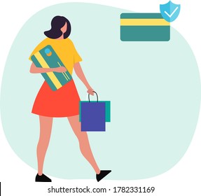 Girl walking with a credit card and packages in her hands. Secure shopping. 