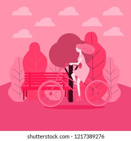 girl walking in a park on bike	