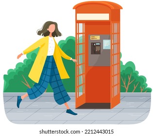 Girl Walking In Park, Payphone Stands On Sidewalk In Street Near Green Trees. Park Symbol Red Opened Street Phone . Empty London Classic Telephone Booth With An Open Door, Woman Strolls Alone