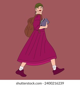 A girl walks with books and a backpack