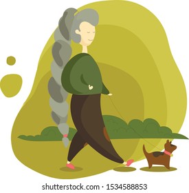 Girl walks with a dog in the park