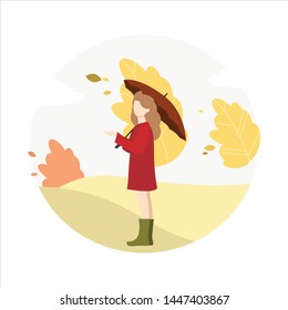 Girl walks in the park in autumn.