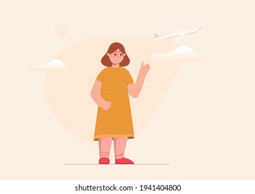 A girl is waving her hand up in the air. Cute but little bit sad girl is whistling goodbye to her parents from the airport.