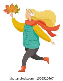 Girl wearing casual and warm clothes holding leaves. Happy woman listening music in headset. Female character running with yellow foliage in autumn park. Person in scarf going outdoor vector