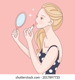 A girl wearing a polka dot dress with her favorite lipstick.