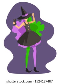 girl wearing purple and green wig and witch hat doing selfie on halloween