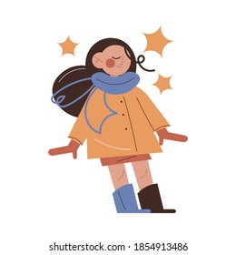 Girl wearing warm jacket, mittens and boots for walks and playing outdoors