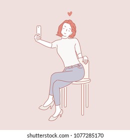 A girl who sits on a chair and stamps her selfie. hand drawn style vector doodle design illustrations.