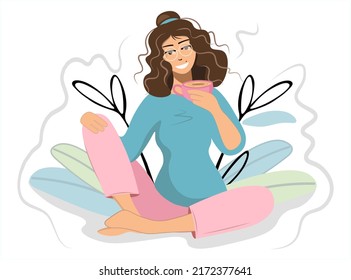 Girl, woman drinks an invigorating drink. The brunette loves coffee. Smiling lady with a cup of tea, cocoa in home clothes sits in a comfortable position. Vector flat style with decorative leaves.