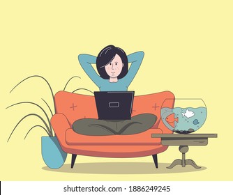 Girl working at home with laptop while sitting on the couch.