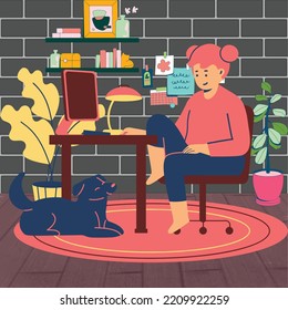Girl working on home computer with her dog