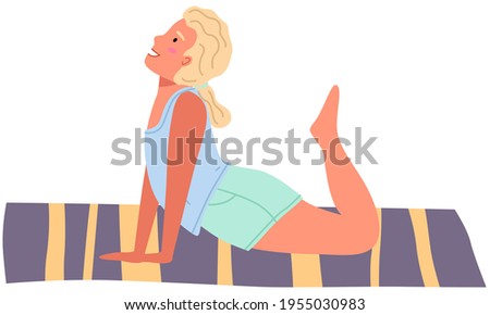 Girl working out doing exercise at home. Woman doing yoga on mat. Sportswoman stretches in apartment