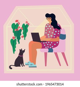 a girl works at a computer at home at remote work with her pet dog